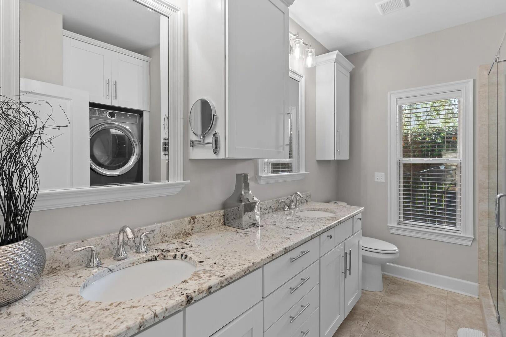 2059 Mack Bayou Road Santa Rosa Beach, FL 32459 - Photo 13 of 51 a bathroom with a sink a toilet and a mirror