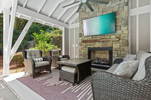 a living room with furniture and a fireplace