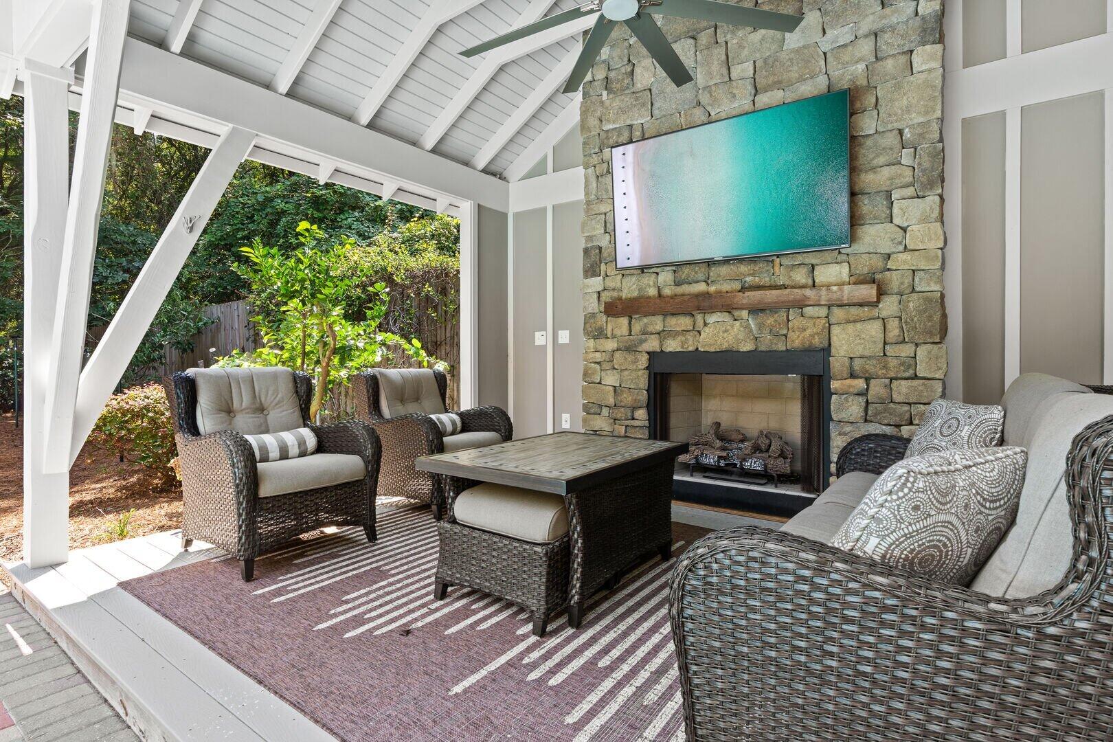 2059 Mack Bayou Road Santa Rosa Beach, FL 32459 - Photo 17 of 51 a living room with furniture a flat screen tv and a fireplace
