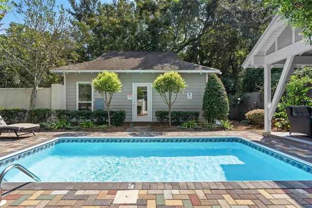 a room with furniture a window and wooden floor