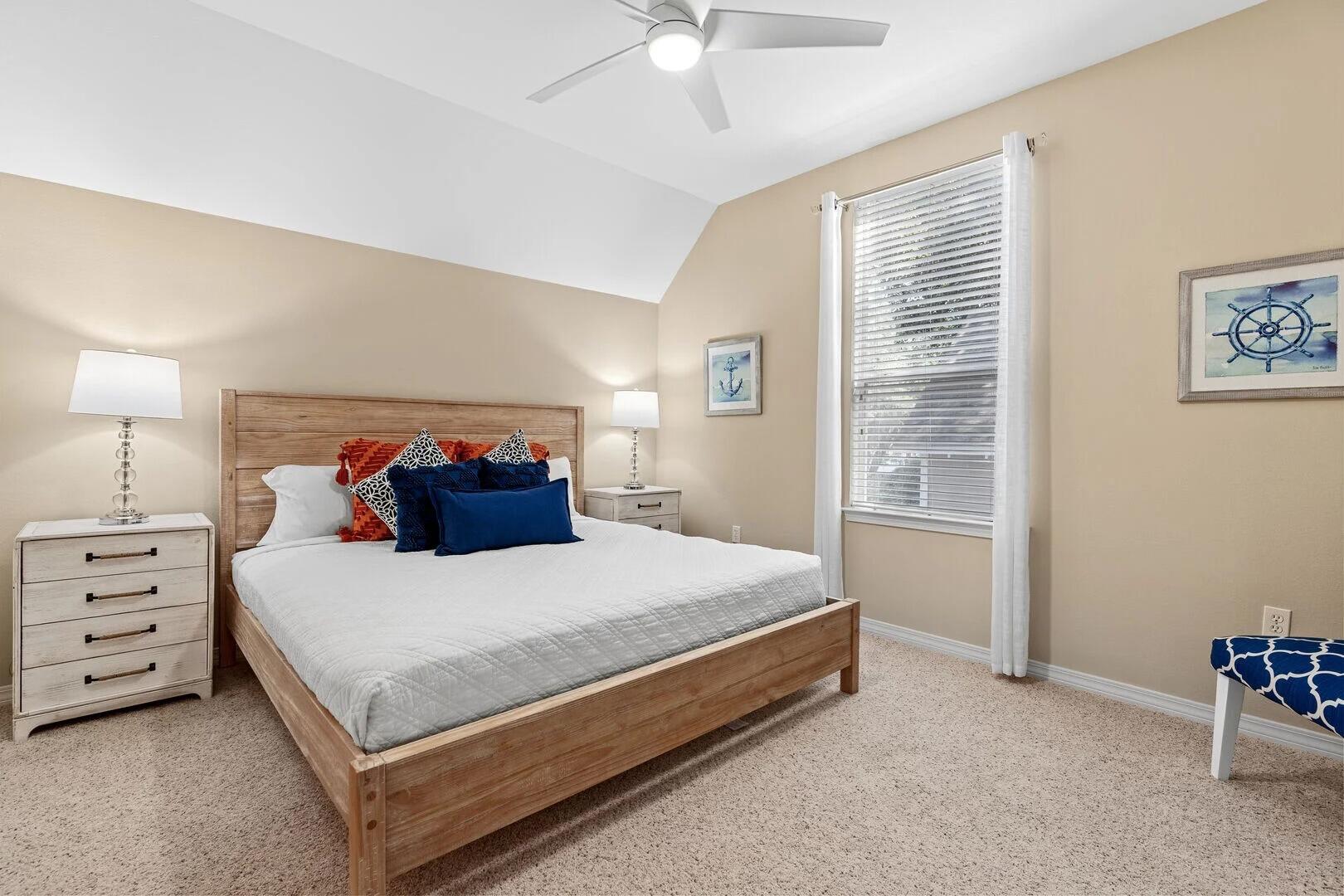 2059 Mack Bayou Road Santa Rosa Beach, FL 32459 - Photo 40 of 51 a bedroom with a bed and a chandelier