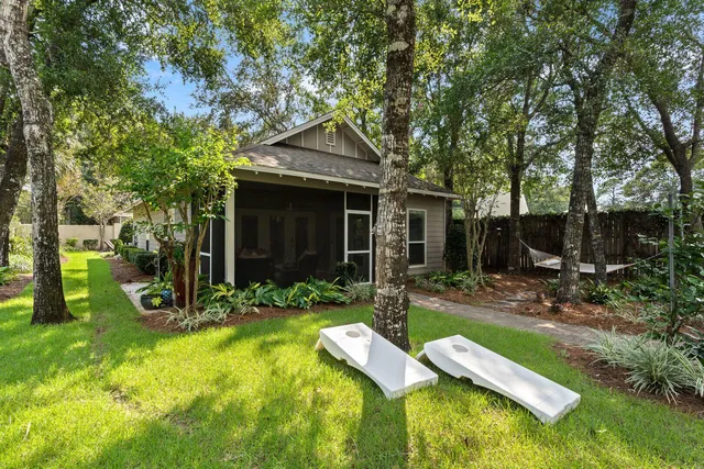 a view of a porch with furniture and garden