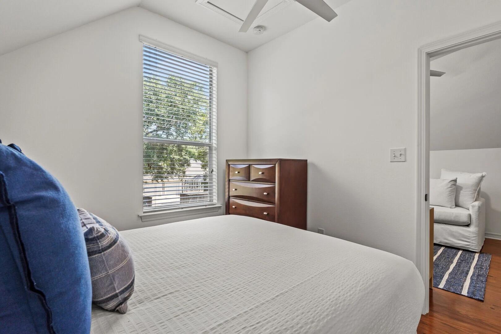 2059 Mack Bayou Road Santa Rosa Beach, FL 32459 - Photo 50 of 51 a bedroom with a bed and a chair with the wooden floor
