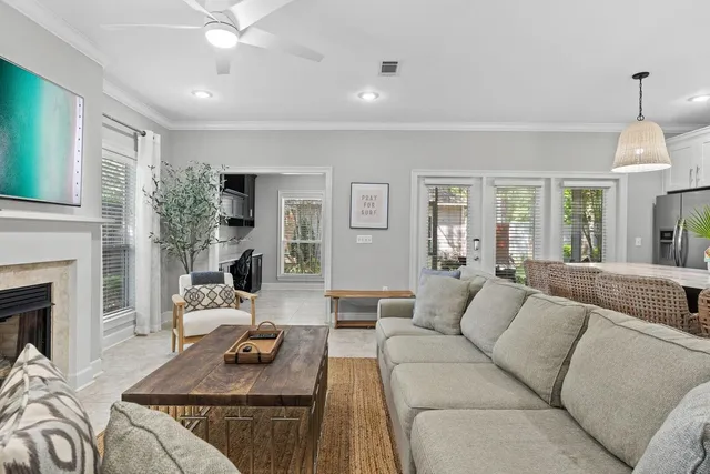 a view of a livingroom with workspace and a window