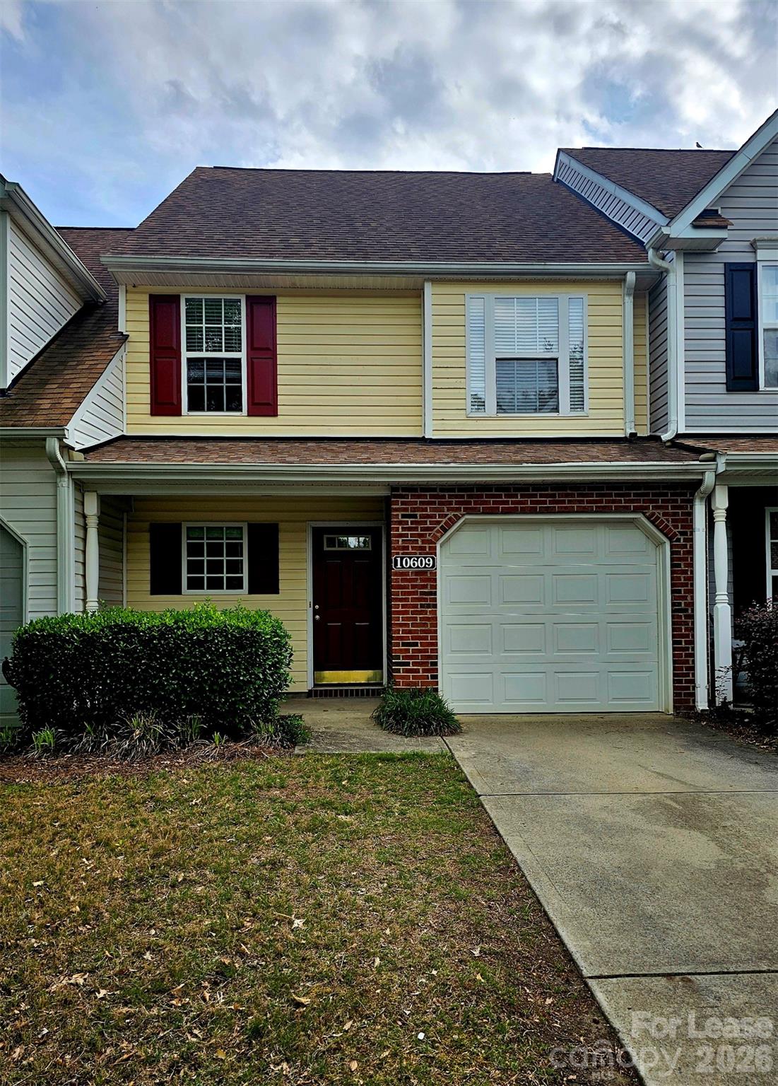 10609 Fuller Ridge Circle Charlotte, NC 28270 - Photo 2 of 29 a front view of a house with a yard and garage
