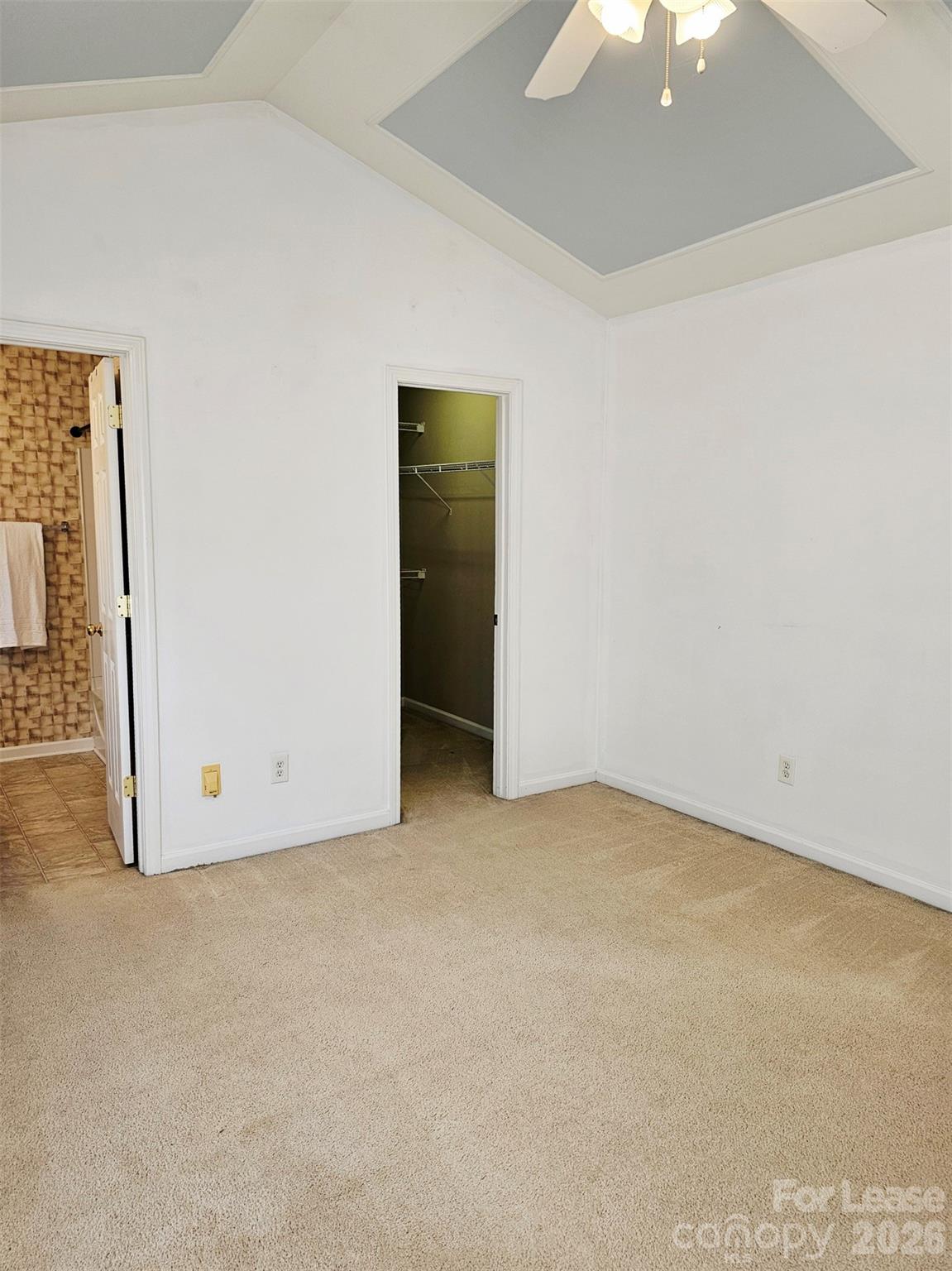 10609 Fuller Ridge Circle Charlotte, NC 28270 - Photo 22 of 29 an empty room with a ceiling fan and closet