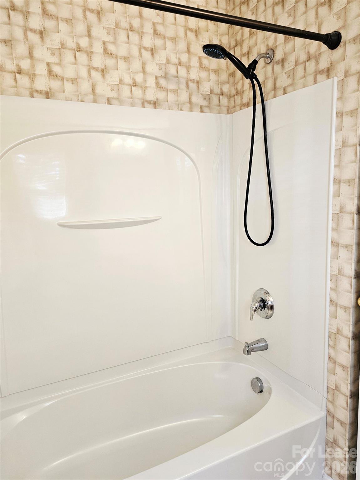 10609 Fuller Ridge Circle Charlotte, NC 28270 - Photo 25 of 29 a bathroom with a bath tub with a shower