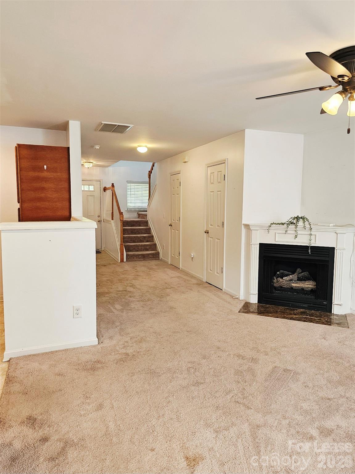 10609 Fuller Ridge Circle Charlotte, NC 28270 - Photo 7 of 29 a view of a livingroom with a fireplace and window