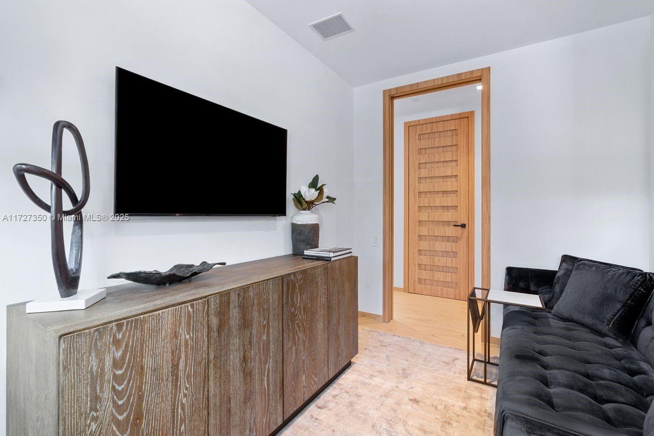 10 Pinta Road Miami, FL 33133 - Photo 18 of 28 a bedroom with bed and flat screen tv