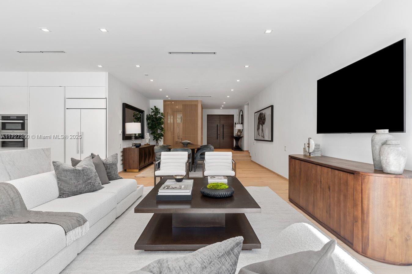 10 Pinta Road Miami, FL 33133 - Photo 23 of 28 a living room with furniture and a flat screen tv