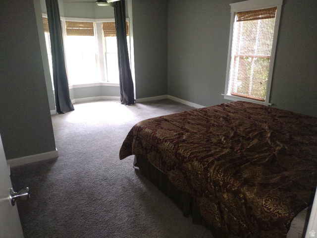 157 West 500 South Logan, UT 84321 - Photo 5 of 38 Room featuring grey carpeting, grey wall paint, and white baseboards