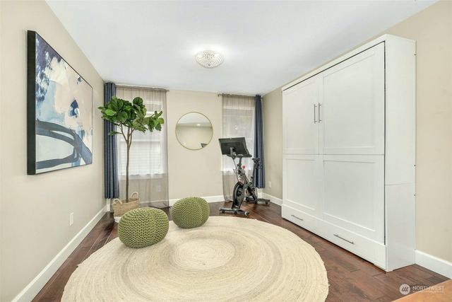 a bathroom with a tub mirror and window