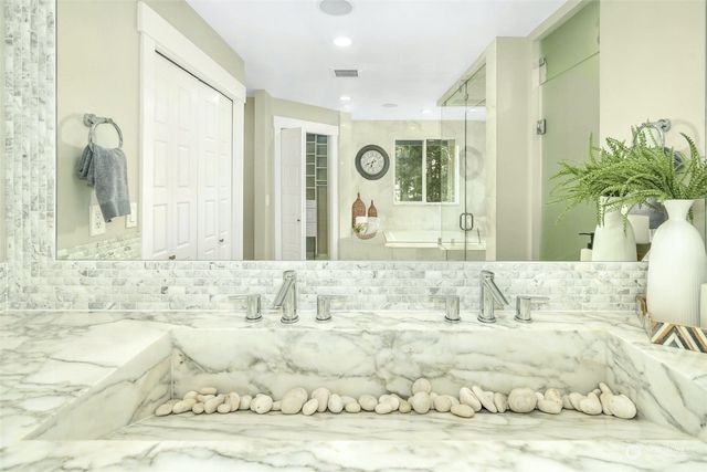 a view of a swimming pool with furniture