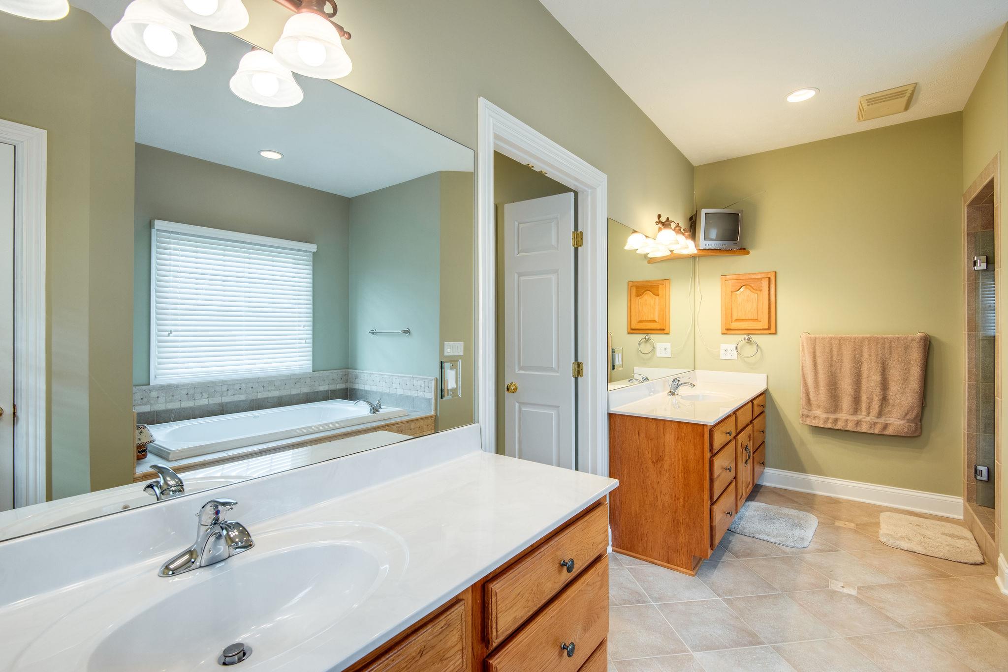 280 North Denny Road Lebanon, TN 37087 - Photo 14 of 30 a bathroom with a tub sink and mirror