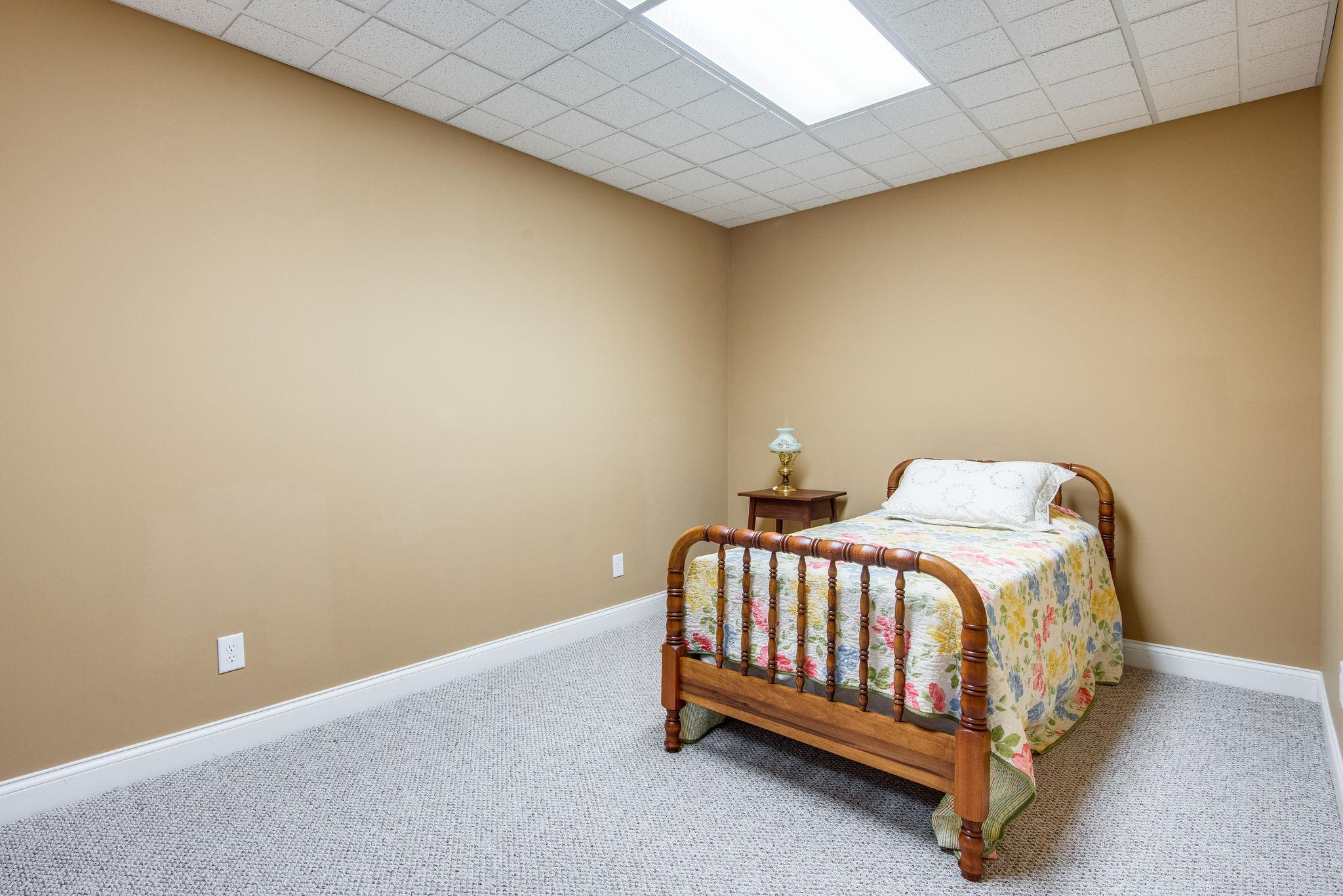280 North Denny Road Lebanon, TN 37087 - Photo 22 of 30 a bed sitting in a room next to a wall