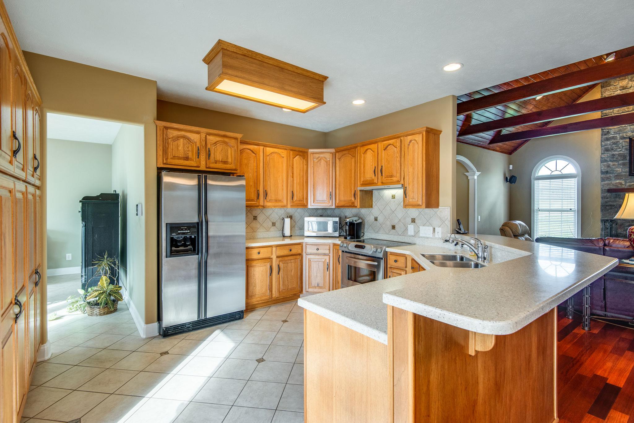 280 North Denny Road Lebanon, TN 37087 - Photo 10 of 30 a kitchen with stainless steel appliances granite countertop a sink a stove and a refrigerator