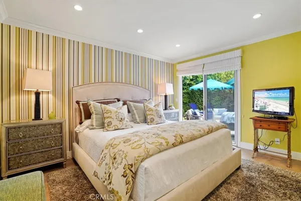 a bed room with a bed and a chair