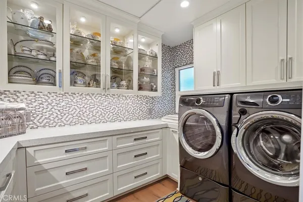a bathroom with a sink a washer and dryer