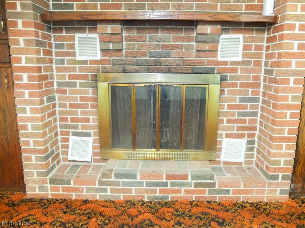7538 Nave Road Southeast Massillon, OH 44646 - Photo 18 of 23 Fireplace in the family room.