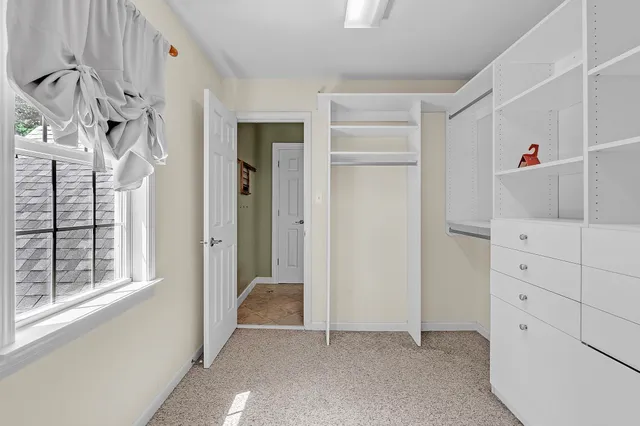 a view of a bedroom with closet