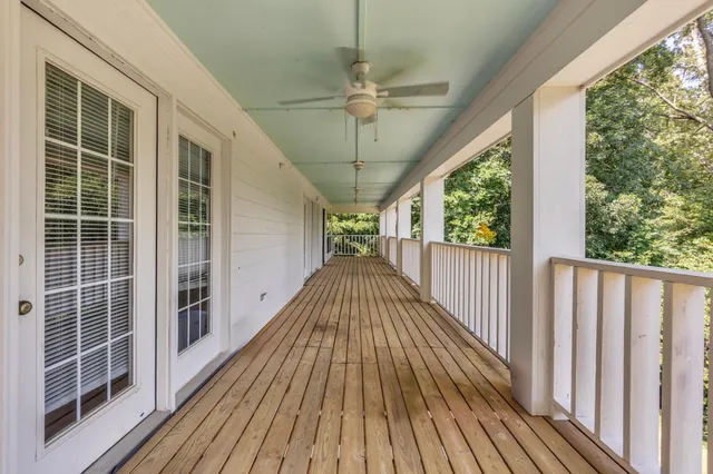 a view of balcony with wooden floor and outdoor space