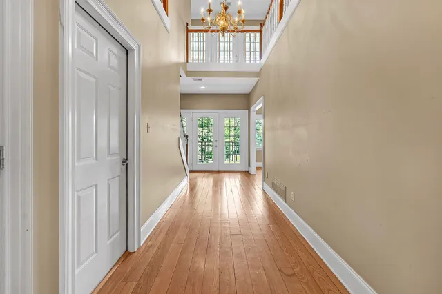 a view of hallway with wooden floor