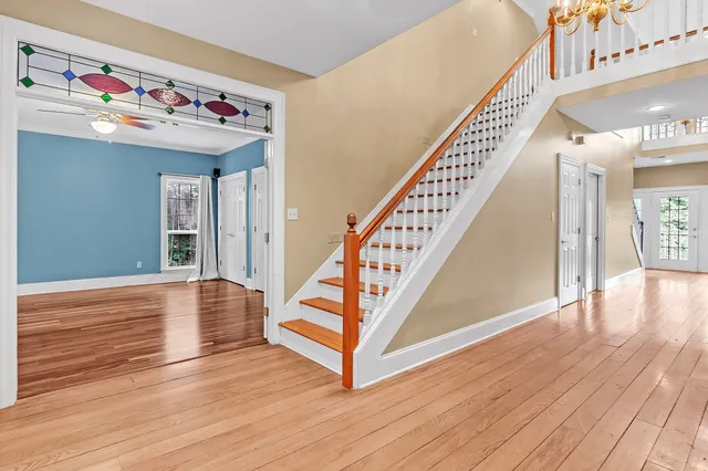 a view of entryway with stairs and wooden floor
