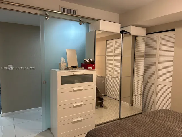 a bathroom with a toilet a sink and shower