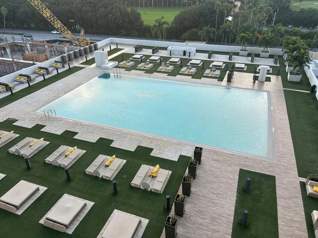 a front view of a house with a garden and plants