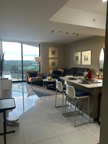 a kitchen with a dining table and chairs