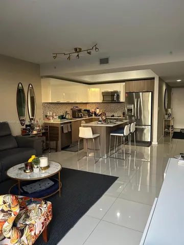 a bedroom with a bed and a night stand