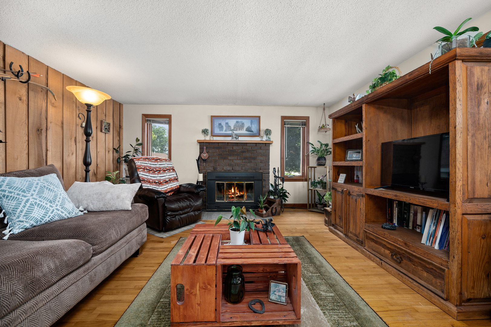 16210 Barber Greene Road Maple Park, IL 60151 - Photo 34 of 52 a living room with furniture and a flat screen tv