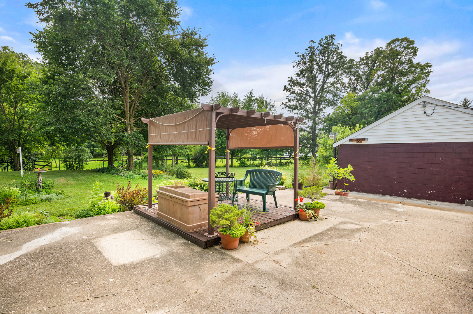 16210 Barber Greene Road Maple Park, IL 60151 - Photo 49 of 52 a view of backyard with a patio and a garden