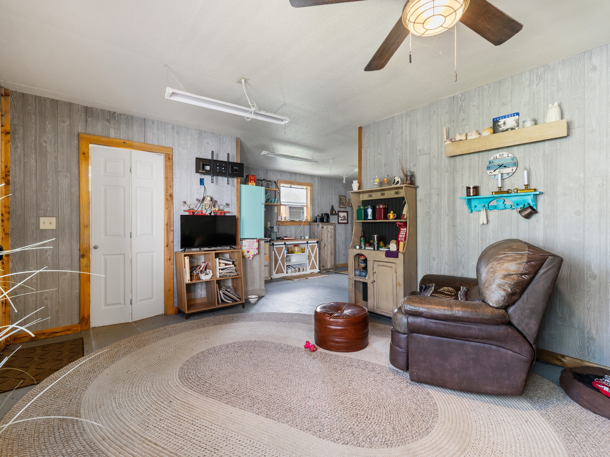 182 Smith Road Palacios, TX 77465 - Photo 12 of 23 a living room with furniture and a flat screen tv