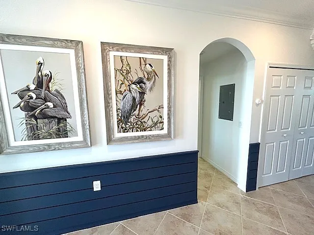 a view of a hallway with closet and a window