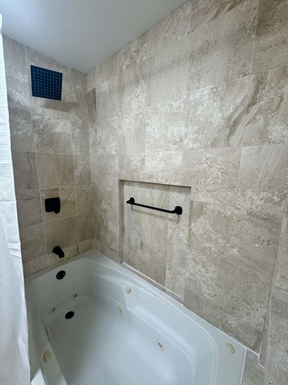 382 Holyoke Street Ludlow, MA 01056 - Photo 11 of 17 a bathroom with a bathtub