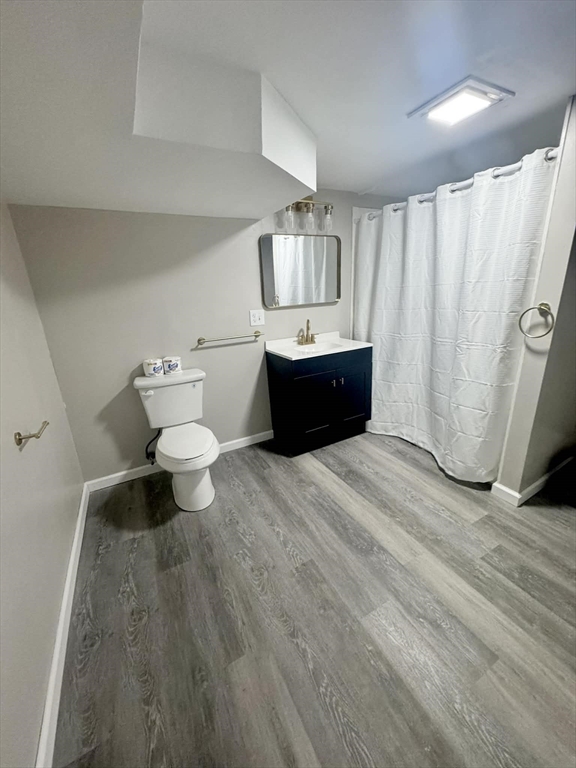 382 Holyoke Street Ludlow, MA 01056 - Photo 12 of 17 a bathroom with a sink toilet a mirror and shower