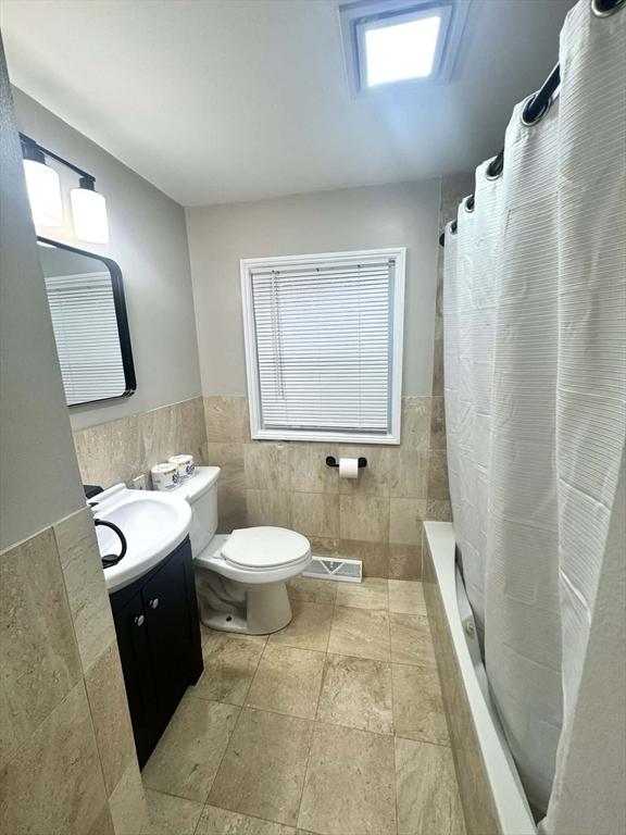 382 Holyoke Street Ludlow, MA 01056 - Photo 10 of 17 a bathroom with a sink a toilet and shower