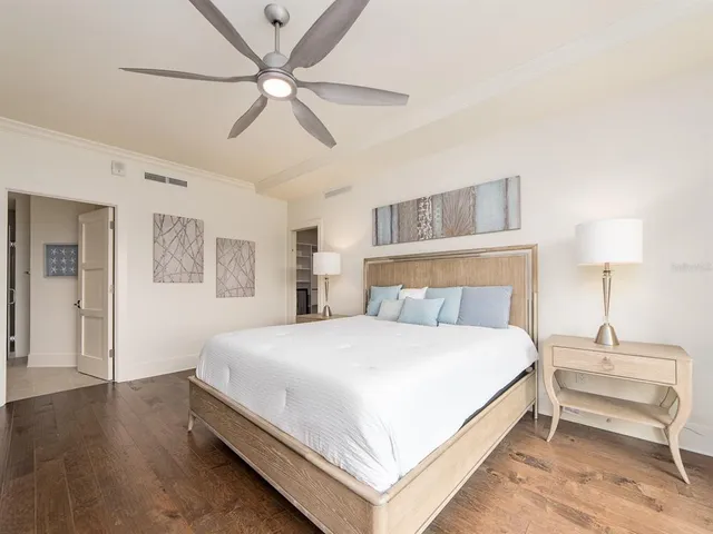 a bedroom with a bed and a table