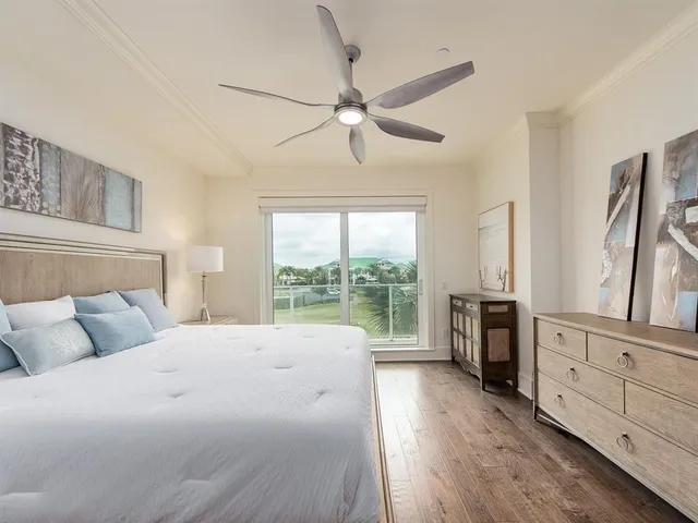 a bed room with a bed and a large window