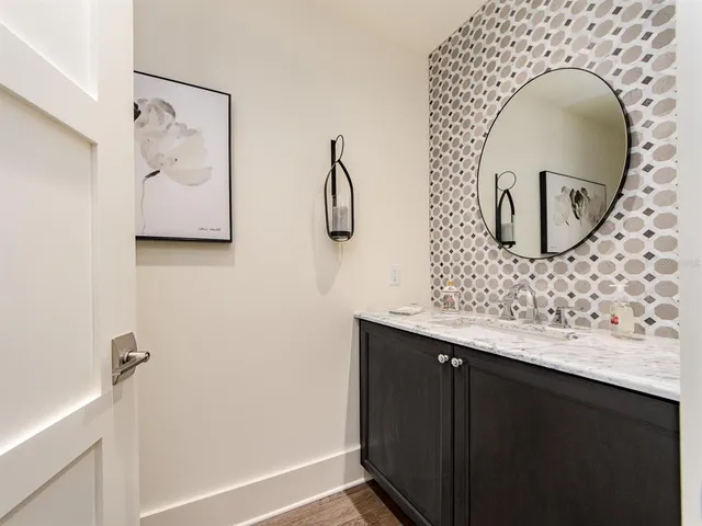 a bathroom with a sink and mirror