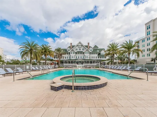 a view of a swimming pool with a table and chairs