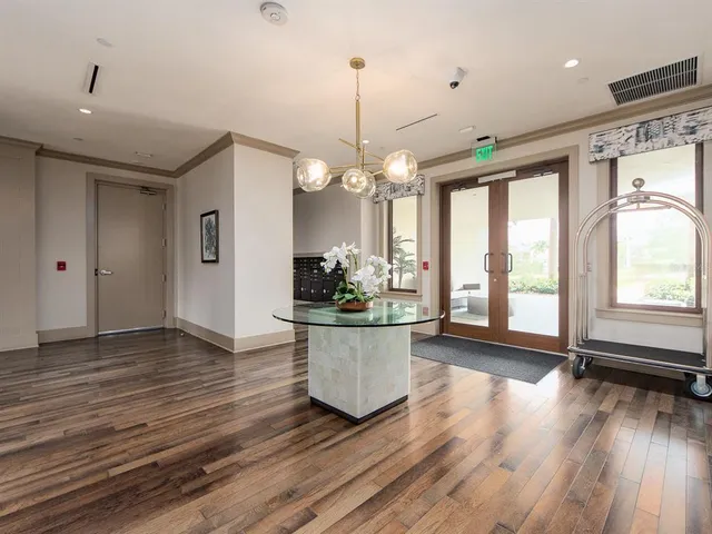 a view of a kitchen with stove and wooden floor