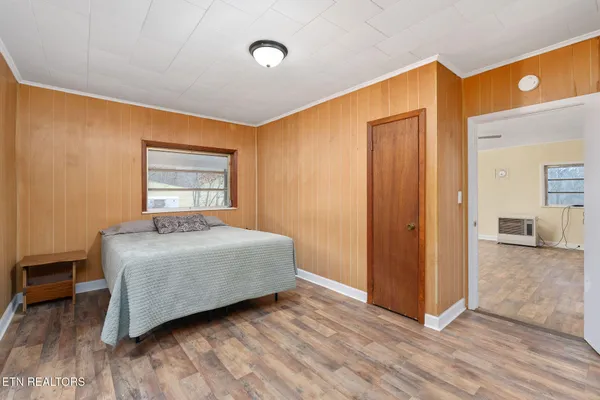 a bedroom with a bed and a closet