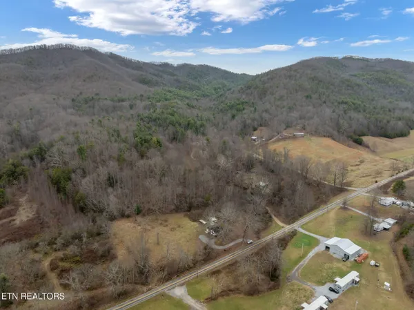 a view of a yard with a table and chairs