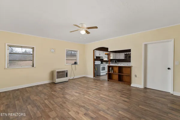 a view of kitchen with furniture and wooden floor