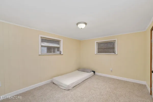 a room with a bed and a window