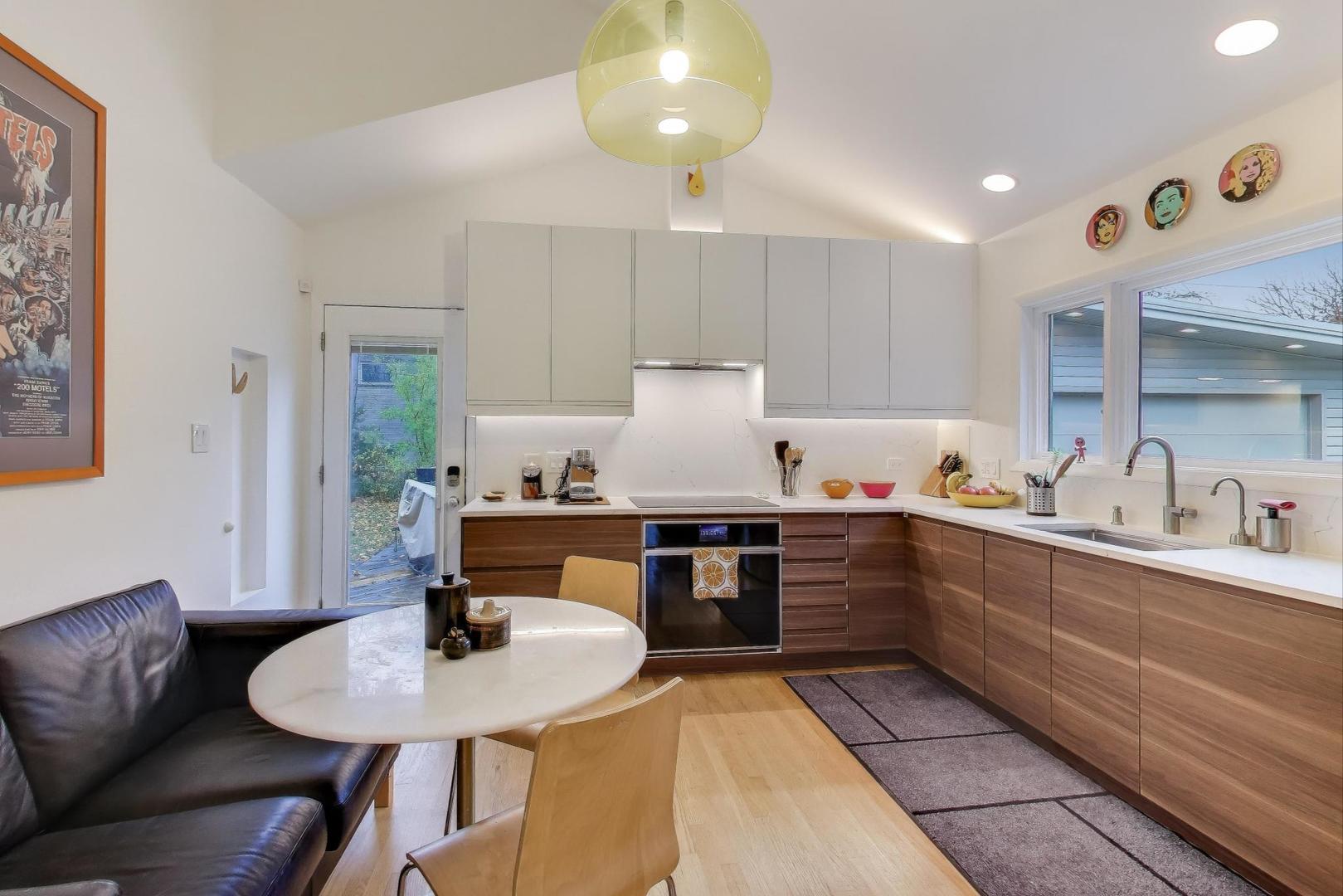 321 Ferndale Road Glenview, IL 60025 - Photo 11 of 30 a kitchen with sink refrigerator dining table and chairs