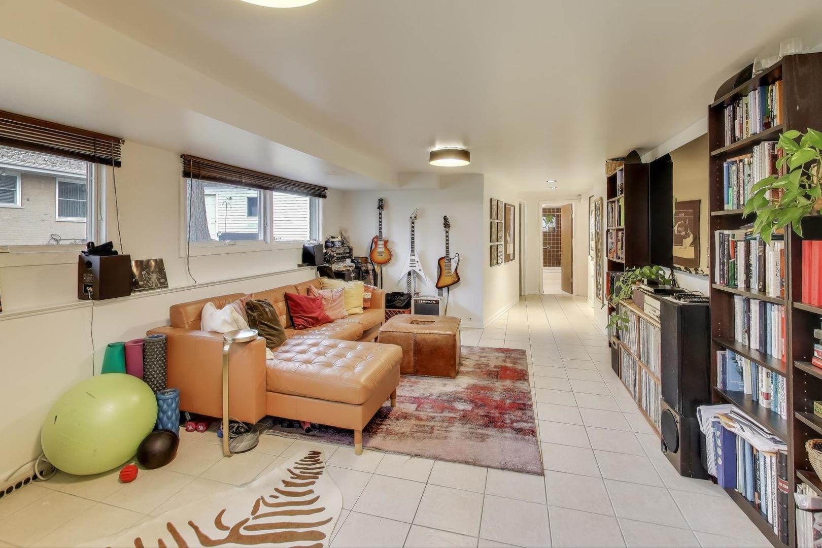 321 Ferndale Road Glenview, IL 60025 - Photo 15 of 30 a living room with furniture and a book shelf