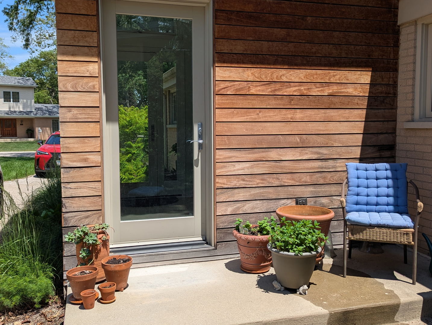321 Ferndale Road Glenview, IL 60025 - Photo 27 of 30 a view of a entryway door of the house with potted plants